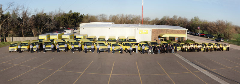 Complete company photo wiith trucks and staff.