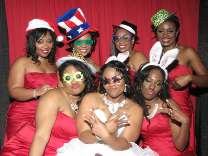 All the ladies from the wedding in a group photo booth photo.